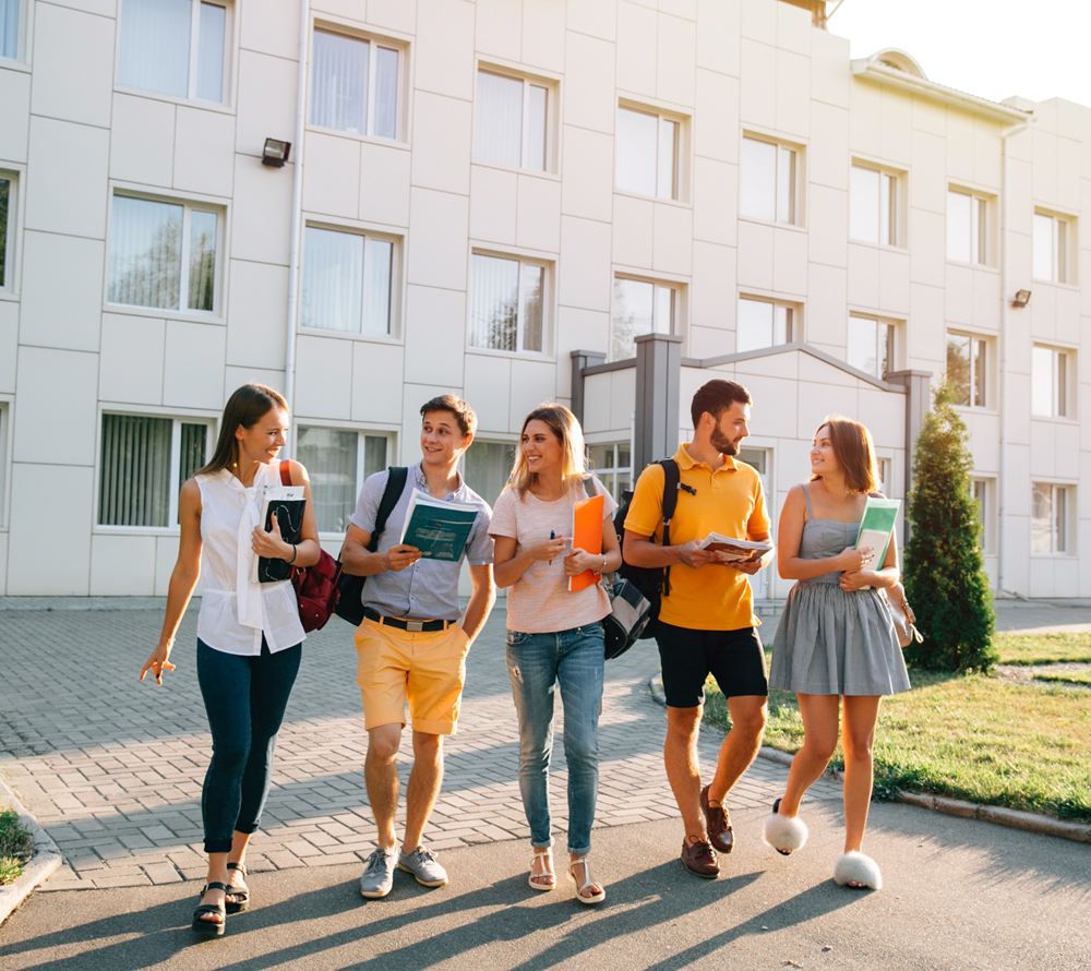 Students walking on campus after passing their WGU OA exams
